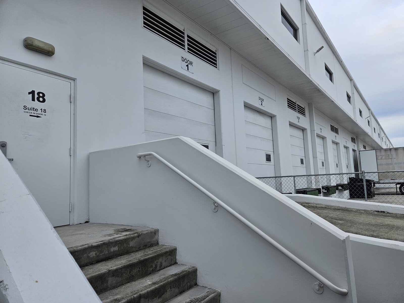 Suite 18 driver check-in entrance next to the loading doors